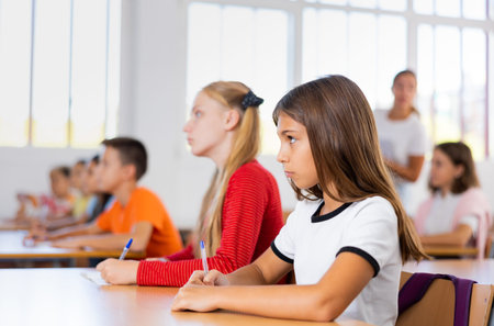 Girls studying subjects in school