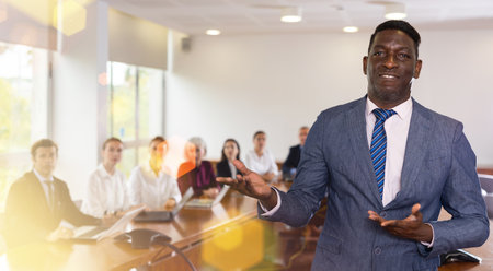 Portrait of confident businessman inviting on meetingの写真素材