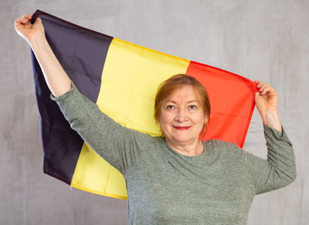 Cheerful senior woman standing confidentlyの写真素材