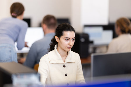 Female student at computers in university computer class