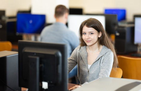 Young woman working on computer in office