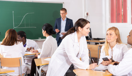 Students talking in the class of medical academyの写真素材