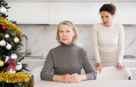 Domestic quarrel between mother and daughter during Christmas celebrationの写真素材