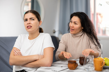 Young female couple quarreling at homeの写真素材