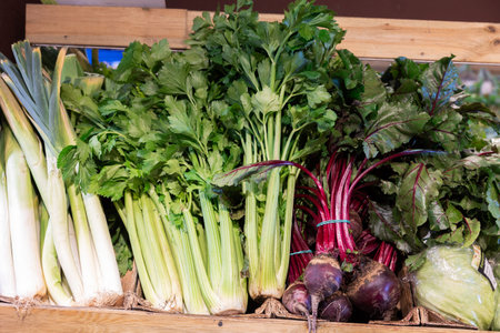 Display cases filled with vegetables in store. Self-service shop offers wide range of vegetables