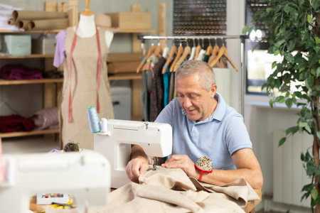 Senior man tailor at work