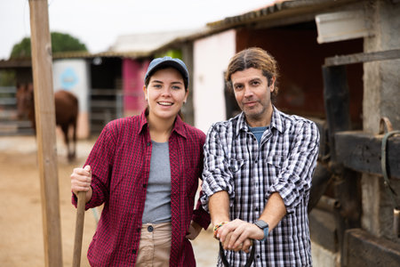 Farmers standing near barnの写真素材