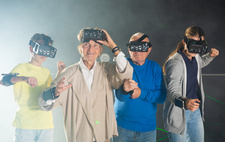 Grandparents with grandchildren are looking for way out of virtual escape roomの写真素材
