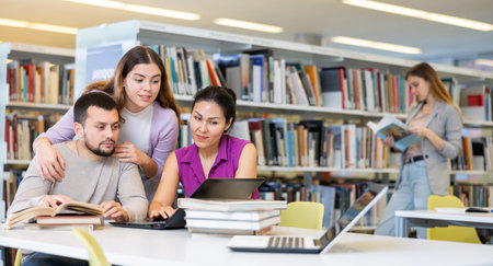 Group of students learning together at libraryの写真素材
