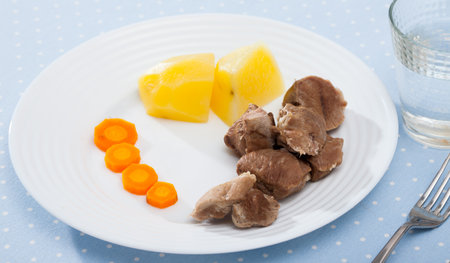 Close up of tasty steamed turkey with boiled potatoes and carrotsの写真素材