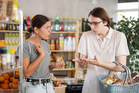 Couple quarrel in a supermarketの写真素材