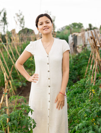 Asian woman at vegetable gardenの写真素材
