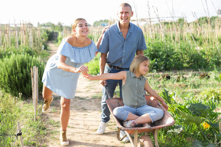 Family walking in kitchen garden