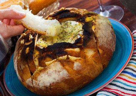 Camembert fondue in bread bowl