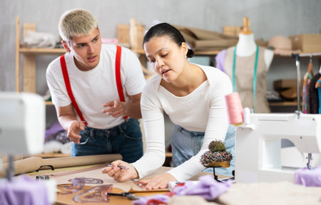 team of tailors working in a workshopの写真素材