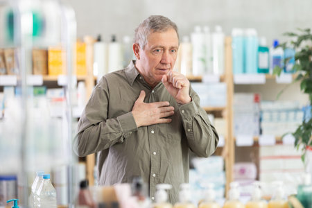 Elderly man with cough in pharmacy
