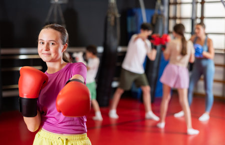 Girl posing during training in boxing glovesの写真素材