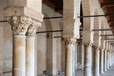 Long corridors under vaulted ceiling in ancient mosque of Kairouan in Tunisia.の写真素材