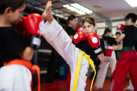 Children in gloves at boxing trainingの写真素材
