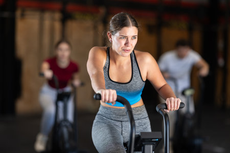 Woman in the top is engaged in an airbikeの写真素材