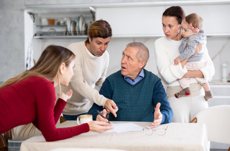 Family members discussing inheritanceの写真素材