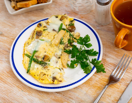 Scrambled eggs with vegetables, chicken and mushrooms