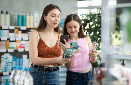 Mom and daughter scan toothbrush barcode on phone