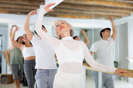 Elderly woman doing ballet at barreの写真素材