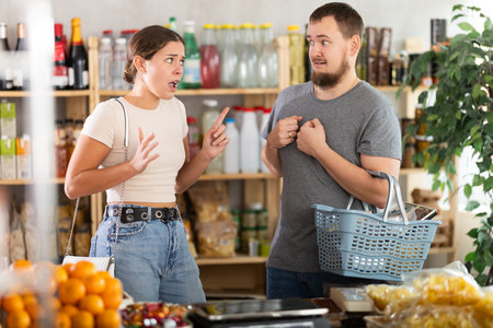 couple arguing at grocery storeの写真素材