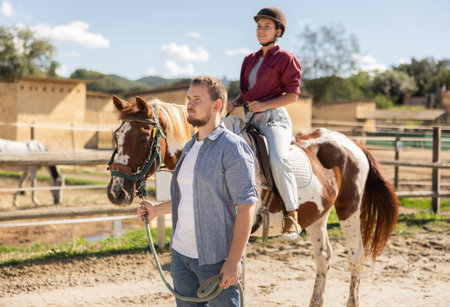 Horseback riding during a tour of horse farmの写真素材