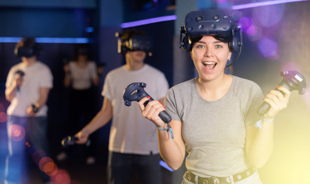 girl is exhilarated by turn of events in VR game and moved virtual reality glasses to forehead