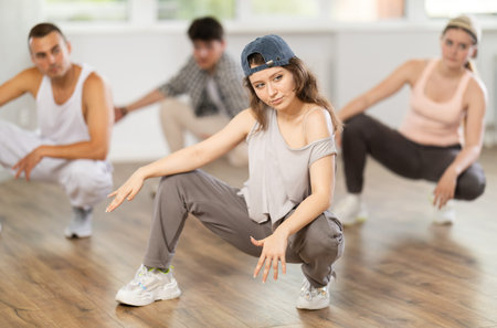 Break dance performed by a group of young dancers in dance studio