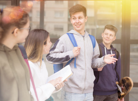 Teenagers have fun talking on street