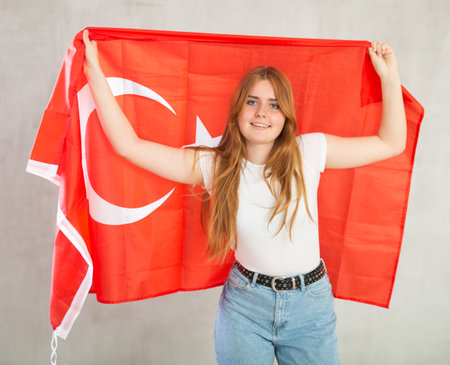 Positive girl with Turkey flag rooting for your favorite teamの写真素材