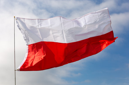 Flag of Poland against background of skyの写真素材