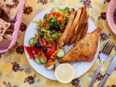 Tunisian brik pie served with vegetable saladの写真素材