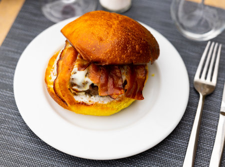 Tasty hamburger with cutlet, cheese and bacon close upの写真素材