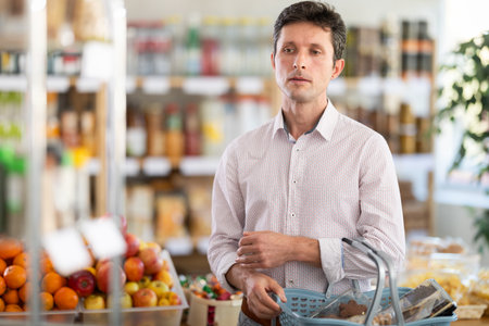 Man came for shopping in a supermarketの写真素材