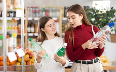 Mother and daughter choose sodaの写真素材