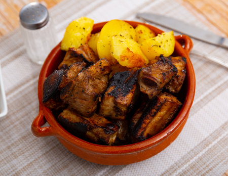 Grilled ribs with potatoes and barbecue sauceの写真素材