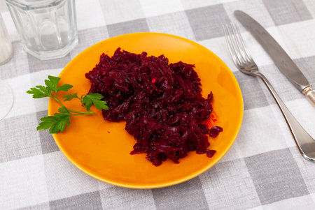 Salad of shredded boiled beets served with fresh greensの写真素材