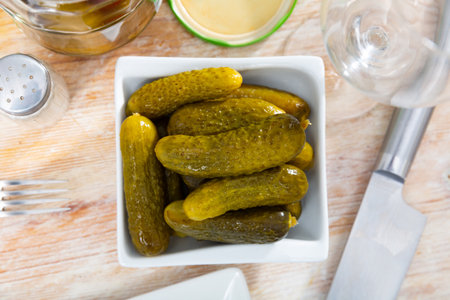 Pickled cucumbers on white plate, homemade preservesの写真素材