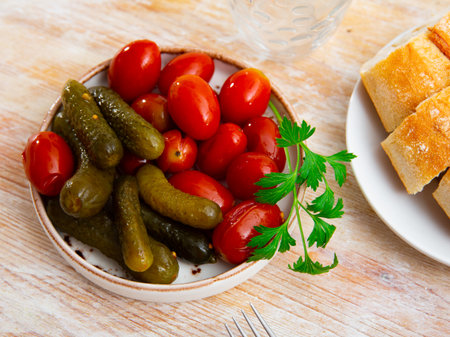 Appetizing pickled cucumbers and tomatoesの写真素材
