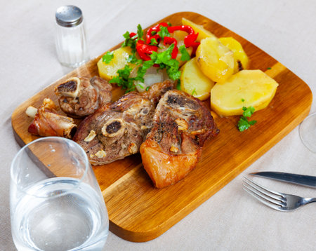 Roasted lamb leg served with grilled organic vegetable and peppe closeupの写真素材
