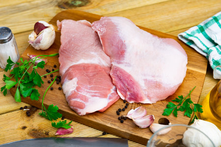 Raw slice of Iberian pork secret and parsleyの写真素材