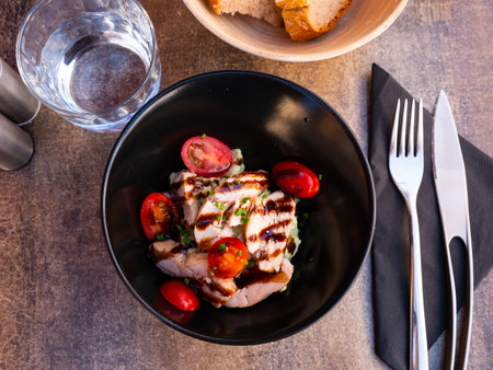 Avocado mayonnaise with grilled chicken and tomatoesの写真素材