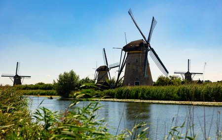 Windmills at Kinderdijk along riversideの写真素材