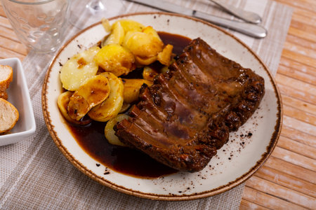 Grilled ribs with potatoes and barbecue sauceの写真素材