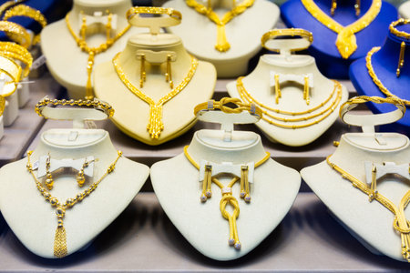 Variety of gold jewelry displayed for saleの写真素材