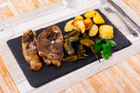 Juicy lamb leg rosted with vegetablesの写真素材